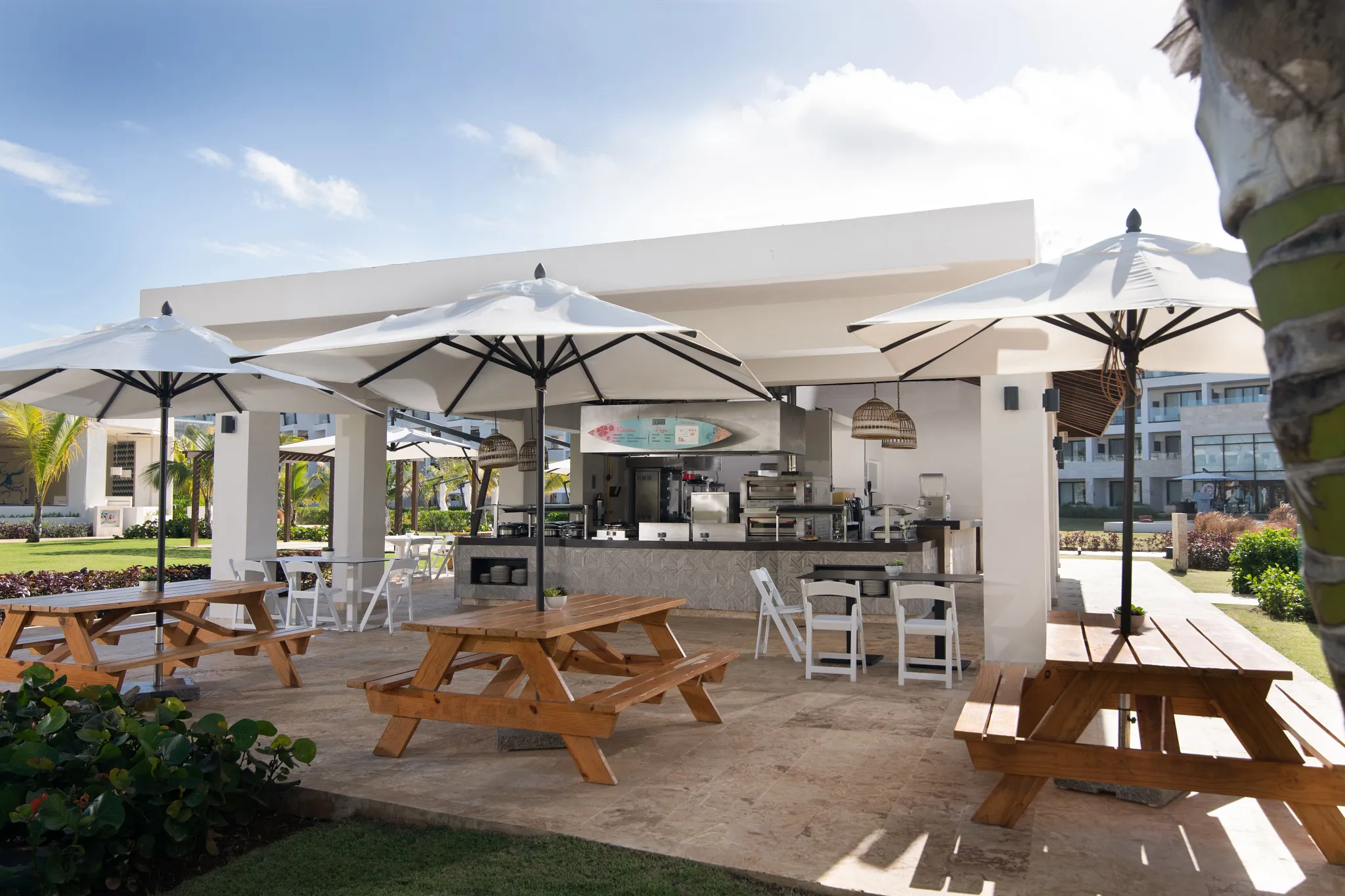 Barefoot Grill at Dreams Macao Beach Punta Cana featuring casual beachfront dining, outdoor seating, and grilled favorites near the pool.