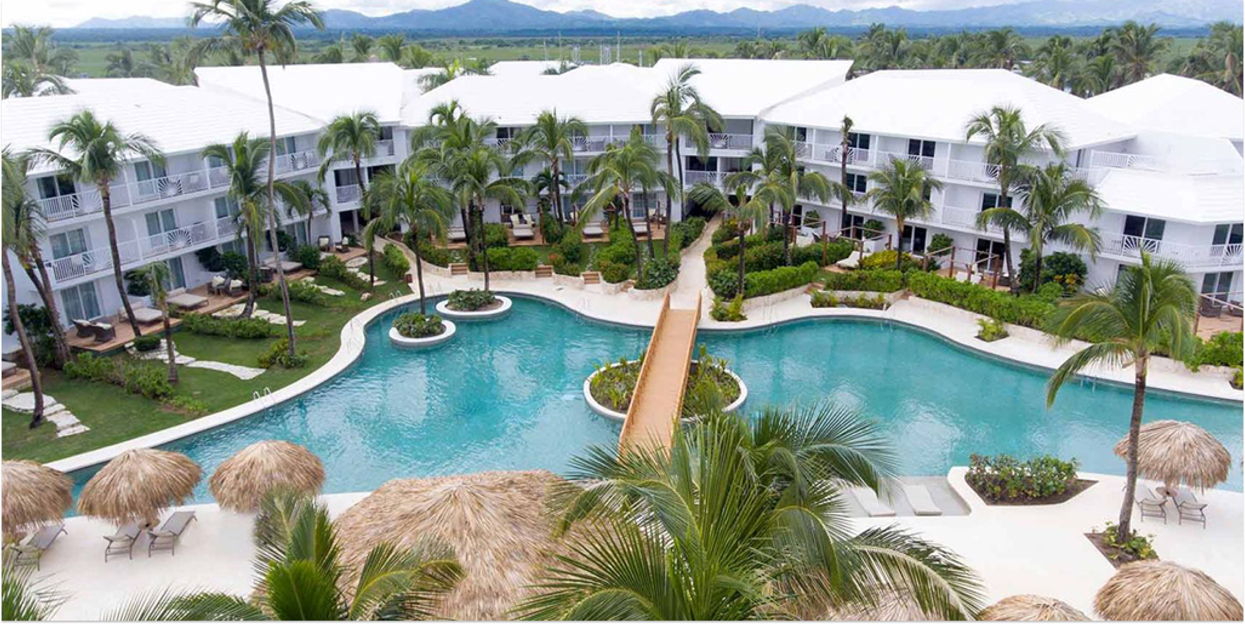 Excellence Punta Cana adults-only luxury all-inclusive resort with pristine beach, elegant suites, and romantic atmosphere in Dominican Republic.