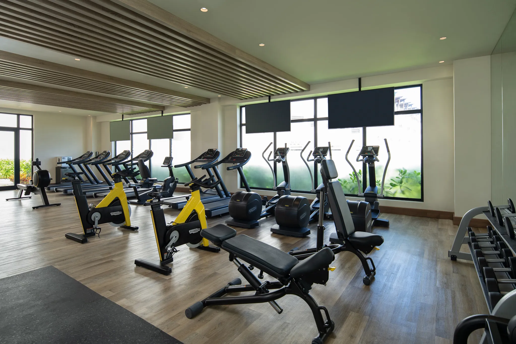 Modern fitness center with cardio and strength equipment at Dreams Macao Beach Punta Cana Resort.