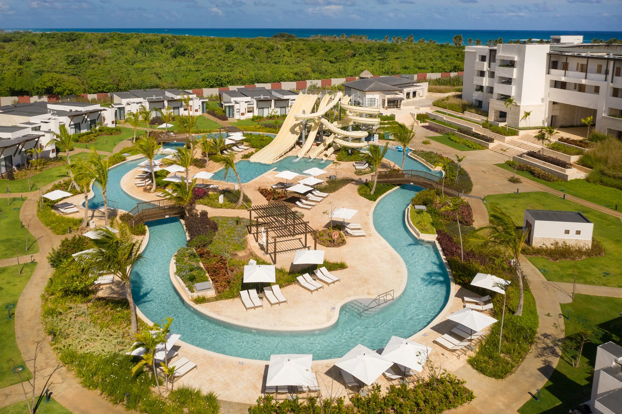 Aerial view of lazy river and water park attractions at Dreams Macao Beach Punta Cana Resort.