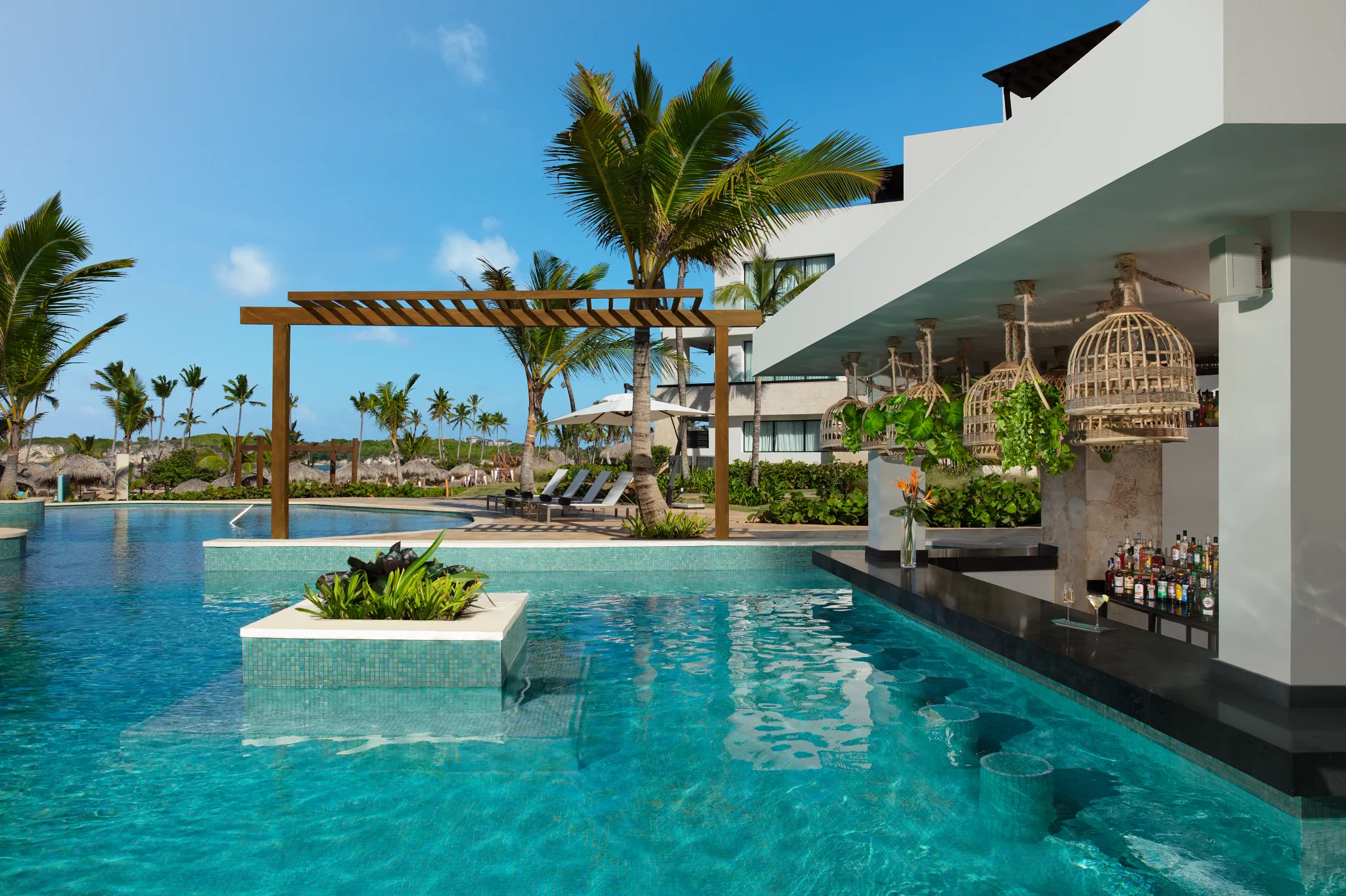Manatees restaurant at Dreams Macao Beach Punta Cana featuring beachfront dining, tropical Caribbean décor, and ocean-view seating.