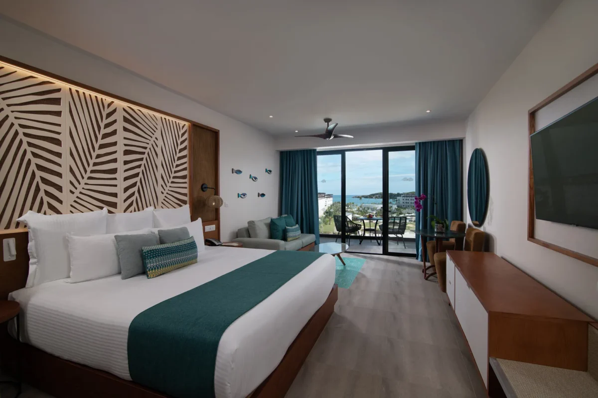Preferred Club Junior Suite Ocean View with king bed and furnished balcony at Dreams Macao Beach Punta Cana.