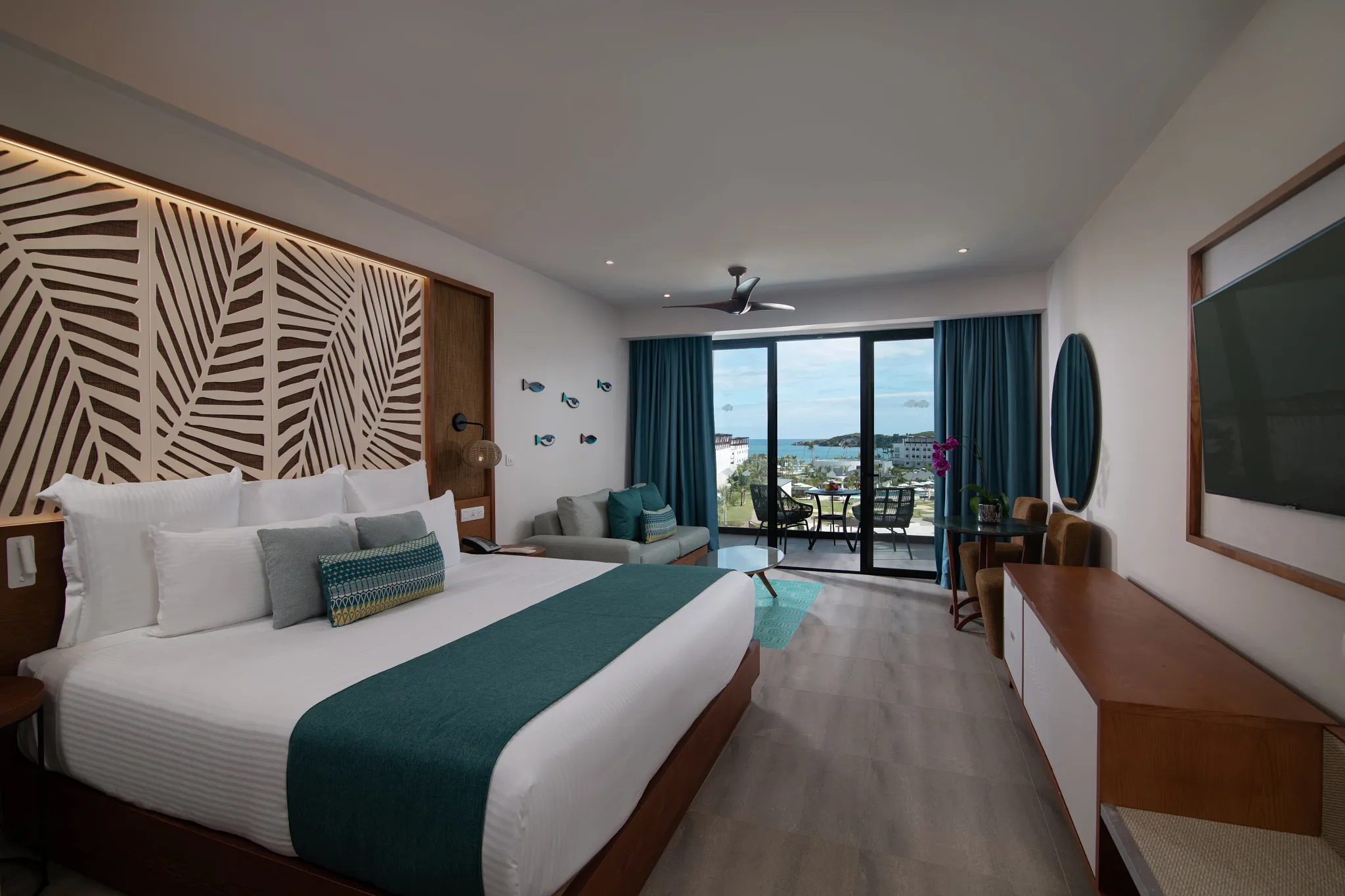 Preferred Club Junior Suite Ocean View at Dreams Macao Beach Punta Cana with king bed, modern décor, and Caribbean ocean views.