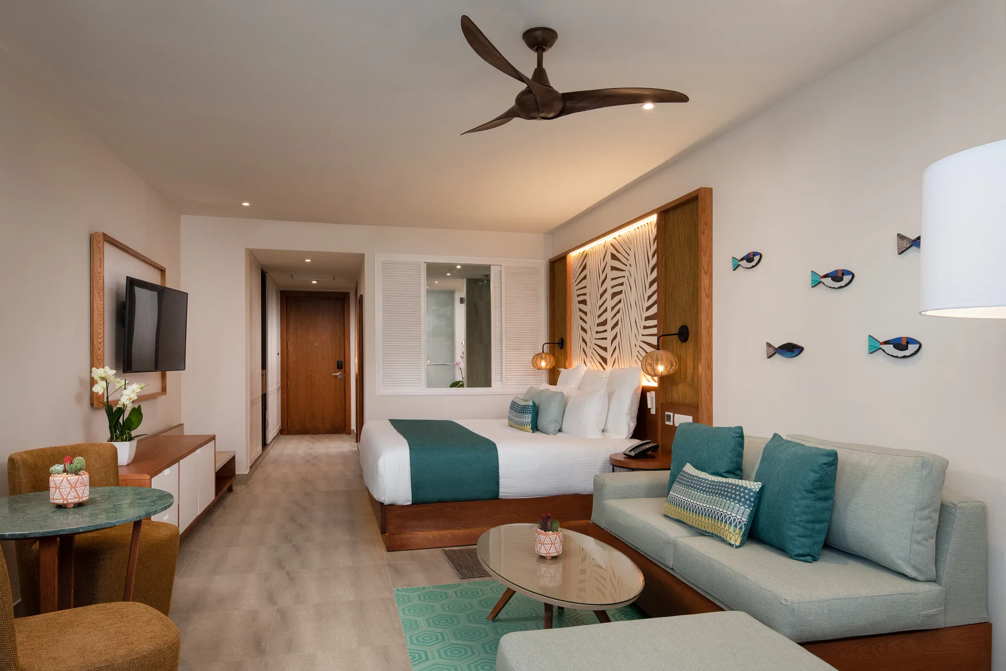 Preferred Club Junior Suite Tropical View with king bed and living area at Dreams Macao Beach Punta Cana.