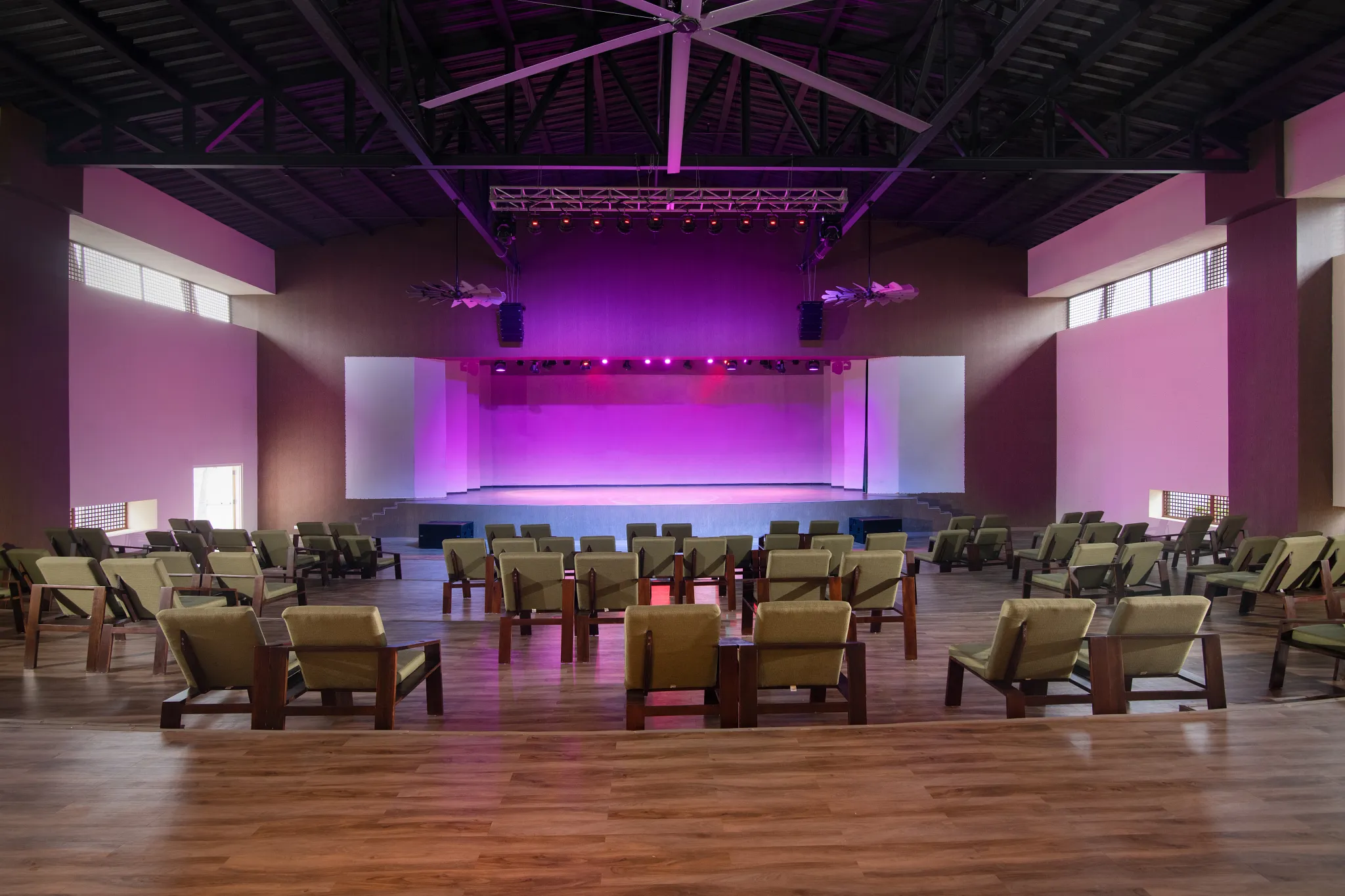 Indoor performance theater with stage lighting and lounge seating at Dreams Macao Beach Punta Cana.