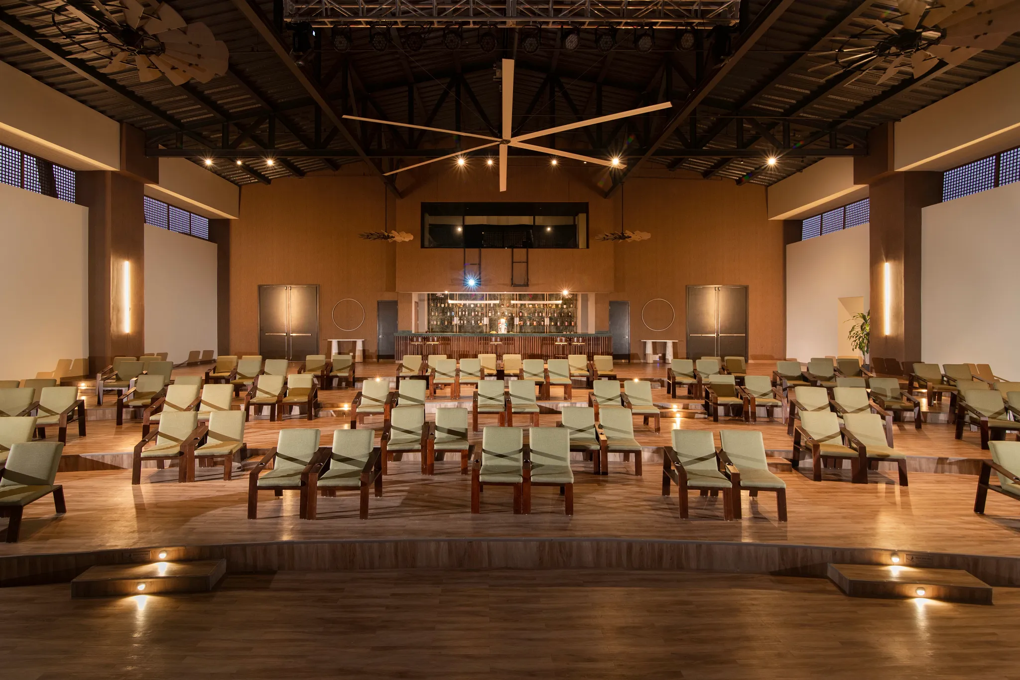 Spacious entertainment theater lounge with stage seating at Dreams Macao Beach Punta Cana Resort.